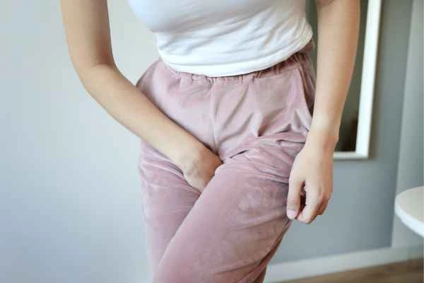 woman struggling with urine incontinence Huddersfield